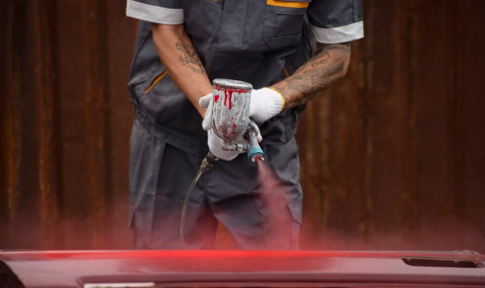 front-view-worker-spraying-powder-paint front-view-worker-spraying-powder-paint